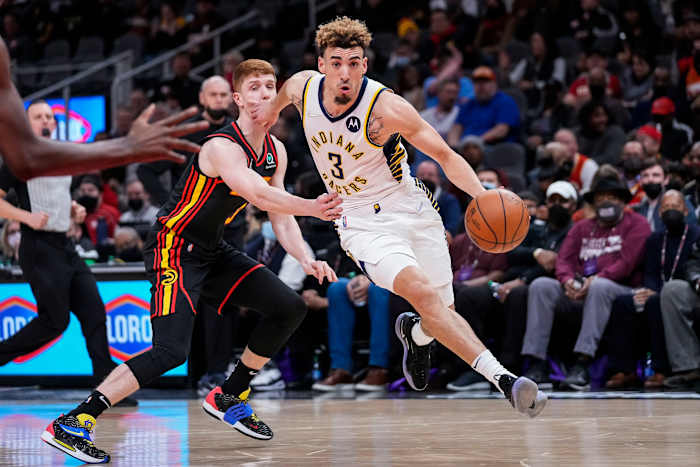 Feb 8, 2022; Atlanta, Georgia, USA; Indiana Pacers guard Chris Duarte (3) dribbles past Atlanta Hawks guard Kevin Huerter (3) during the first half at State Farm Arena.